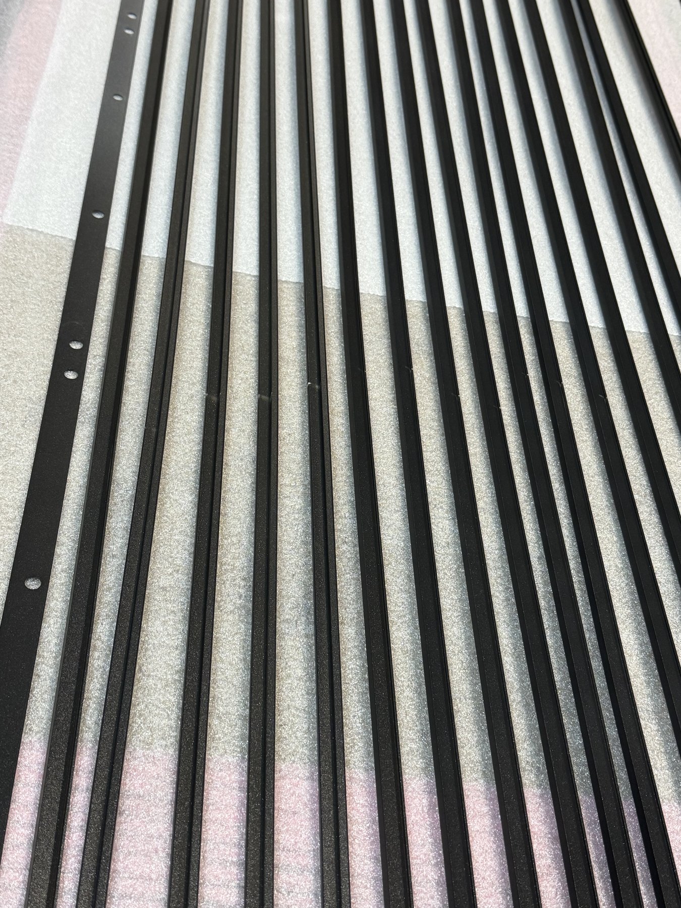 Coated heat-seal bars laid out after coating